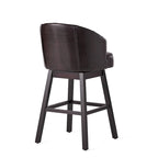 Modern tufted rotating bar stools, adorned with rivets.