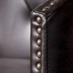 Modern tufted rotating bar stools, adorned with rivets.
