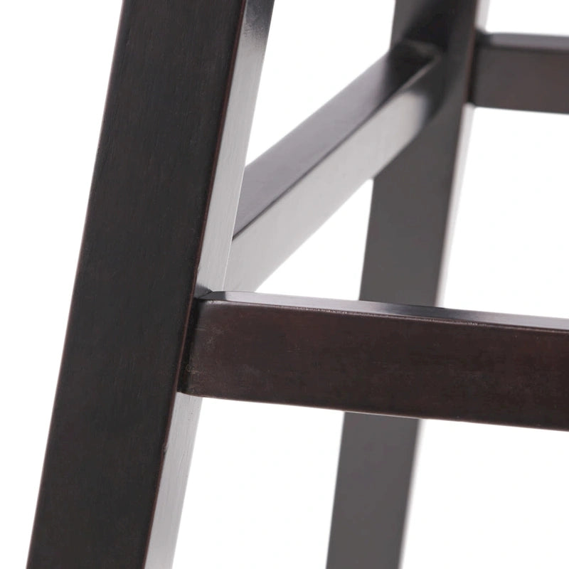 Modern tufted rotating bar stools, adorned with rivets.