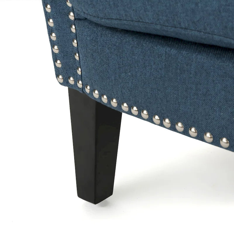 Modern roll-up club chair, adorned with rivet details