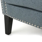 Modern roll-up club chair, adorned with rivet details