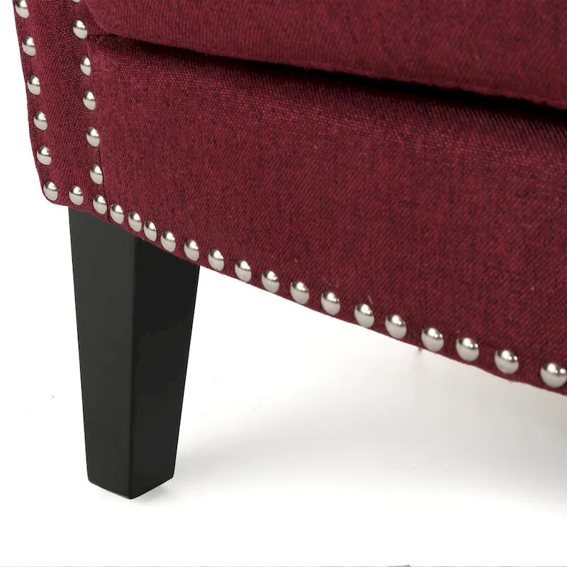 Modern roll-up club chair, adorned with rivet details