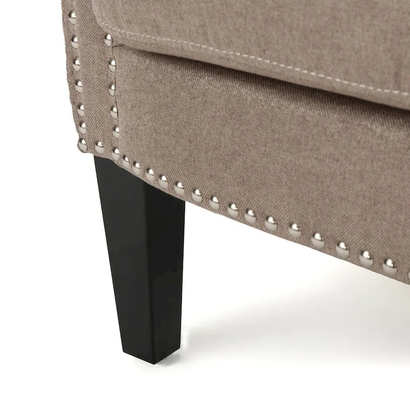 Modern roll-up club chair, adorned with rivet details
