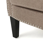 Modern roll-up club chair, adorned with rivet details